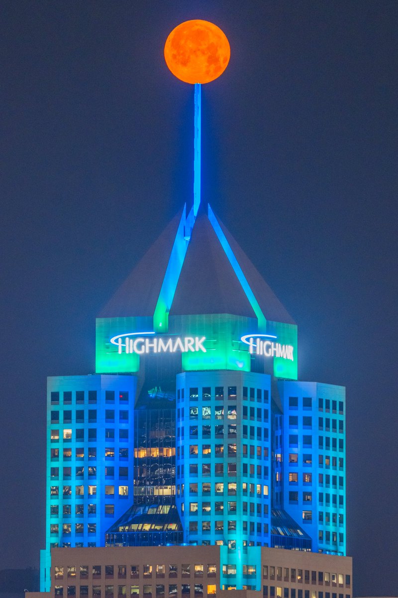 DaveDiCello's tweet image. Catching up on some moon images from #Pittsburgh last month, starting with this one of the Highmark Building. I only had a few minutes between this image and one of PPG Place that I wanted, but it was worth it to capture the moon balancing on the spire.