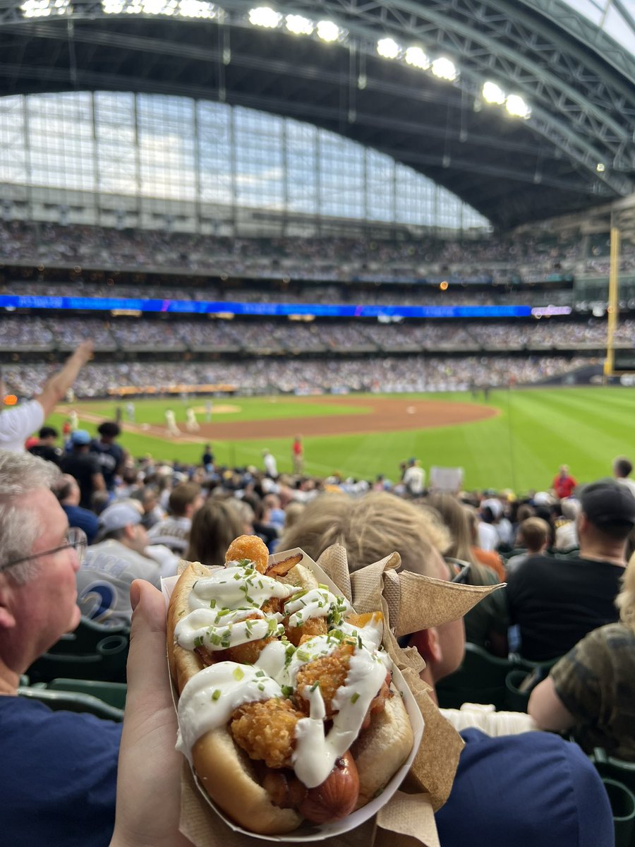 SamDikanovic's tweet photo. Miz strikes out everyone and #AmFamFood is back with this loaded tater tot hot dog https://t.co/aJhrARcNru