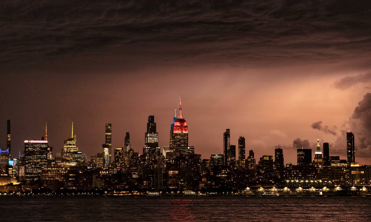 Lightning over Long Island Sound silhouettes the skyline of midtown Manhattan and the Empire State Building in New York City, Tuesday evening #newyork #newyorkcity #nyc <a href="/EmpireStateBldg/">Empire State Building</a> #lightning #storm