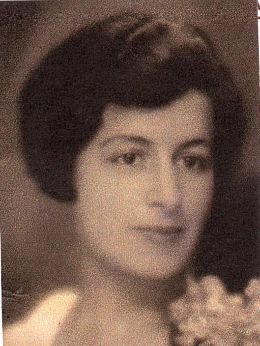 Old portrait of a woman with short hair, wearing a dress with floral detail, looking slightly to their right.