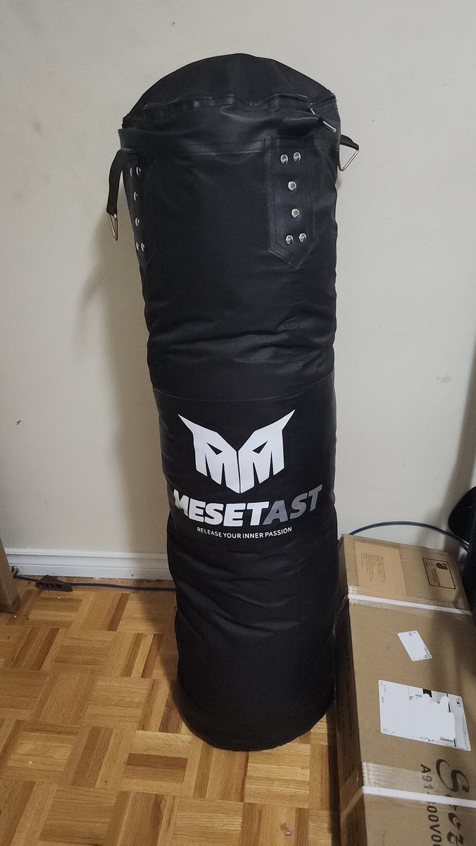 I bought a bag to practice my kickboxing combos at home and I think it's poetic that I stuffed it with my fat clothes that no longer fit.