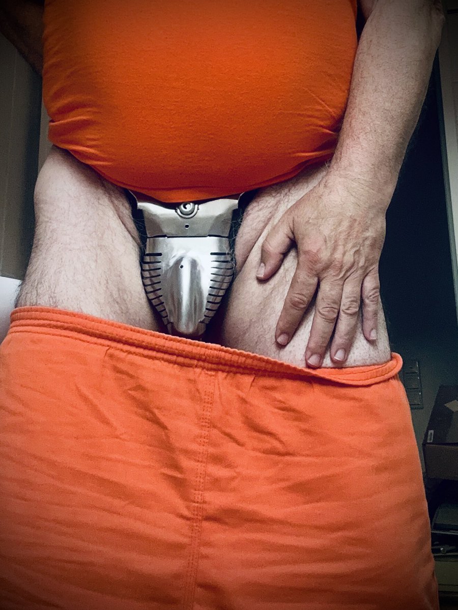 Another change.
The yellow is gone.
This morning, without a word, I was handed a new uniform—bright orange, stiffer than the last. Across the back, bold black letters: PRISONER.

Every movement feels louder in this orange uniform.