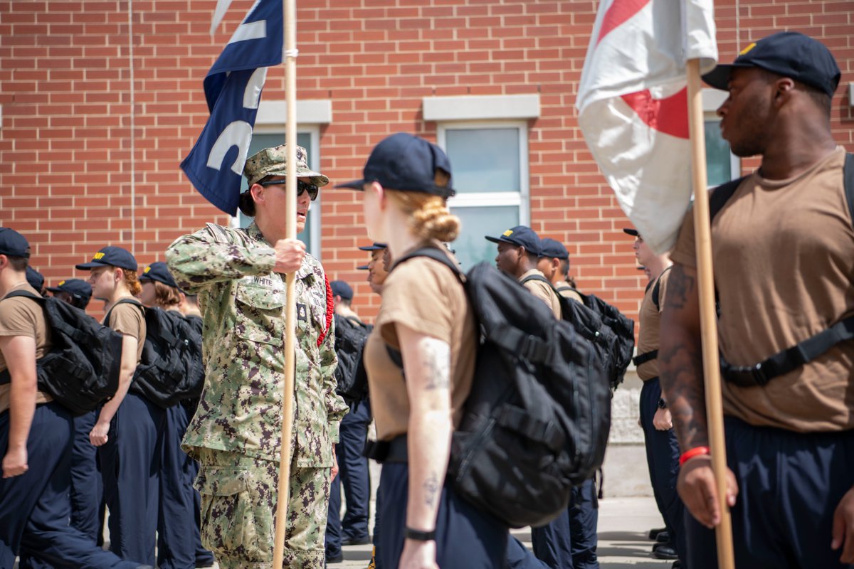 Under the ever-watchful eye of the Chief, where perfection is the bare-minimum. Recruits muster on "the grinder" whether they are entering or leaving their ship. "Last recruit sound off, last recruit!"