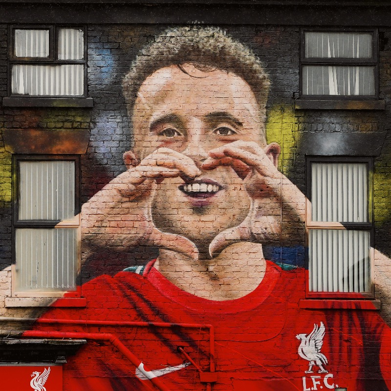 LFCUSA's tweet photo. A special mural tribute to Diogo Jota nearby Anfield, created by artist John Culshaw, has now been completed ❤️
