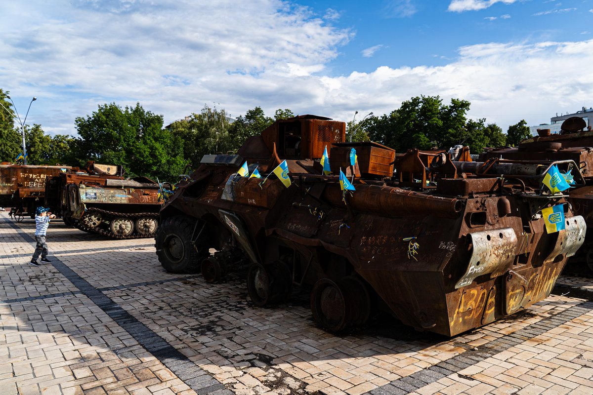 Little boy versus rusty Russian tanks in Kyiv.