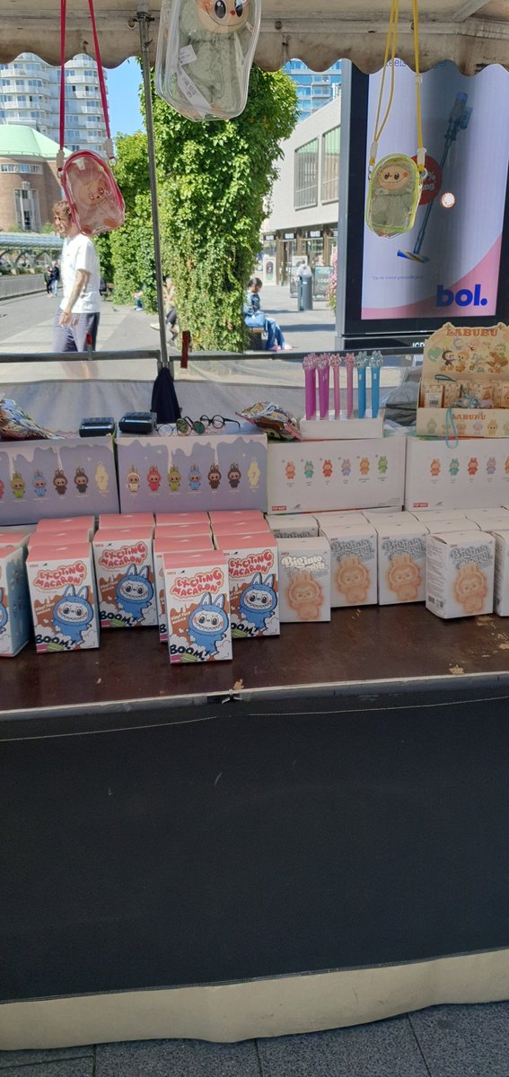 Am omw to work. WHY IS THERE A RANDOM LABUBU STAND HERE??