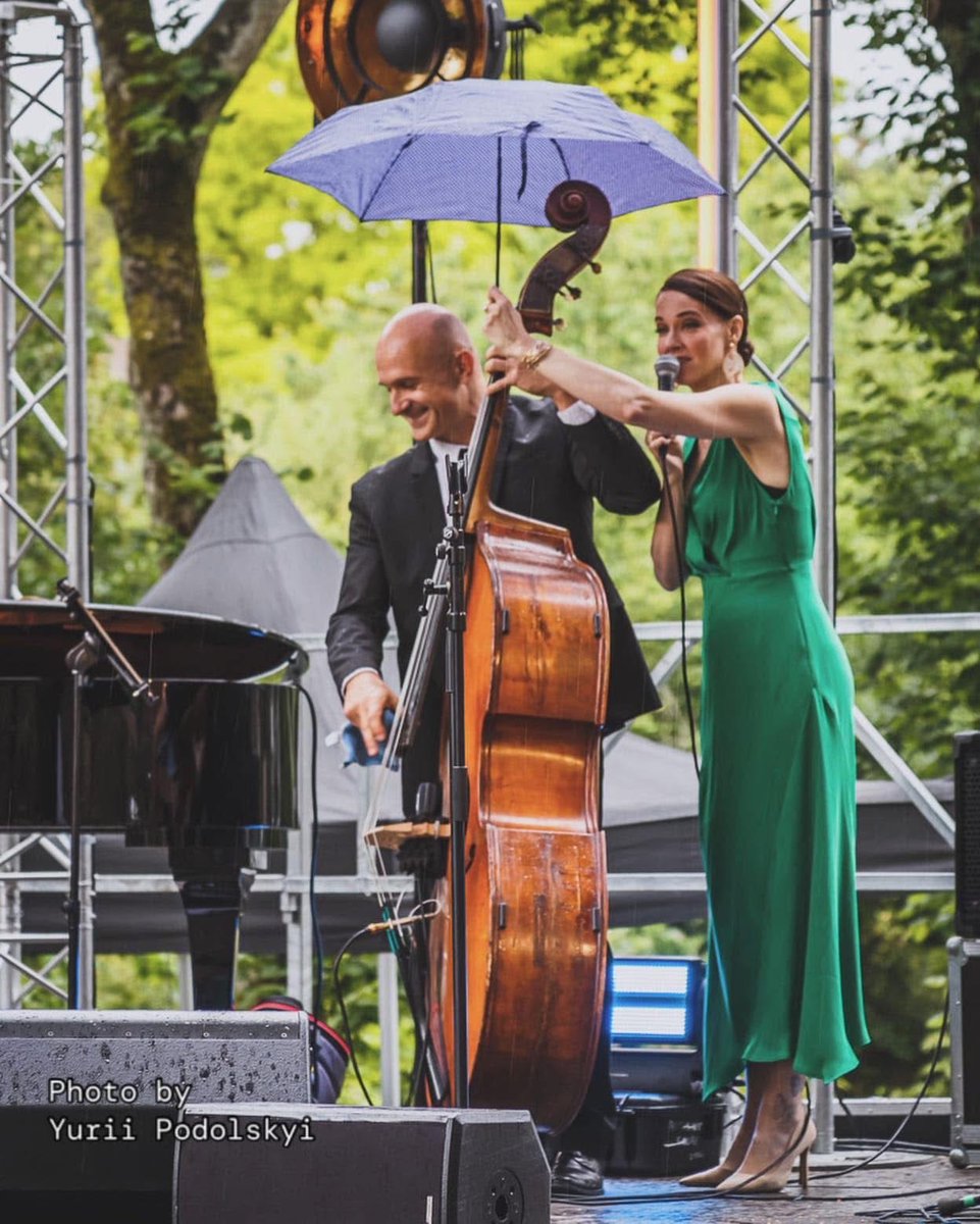 HettyKate's tweet photo. A memory from last year at the Divas du Jazz Festival in Châteaubriant, France. I love this photo! A gig that was scuppered because the organisers didn’t put a roof over the outdoor stage and it absolutely bucketed down with rain after only a few songs. #Singingintherain https://t.co/OFlPi9KHBk