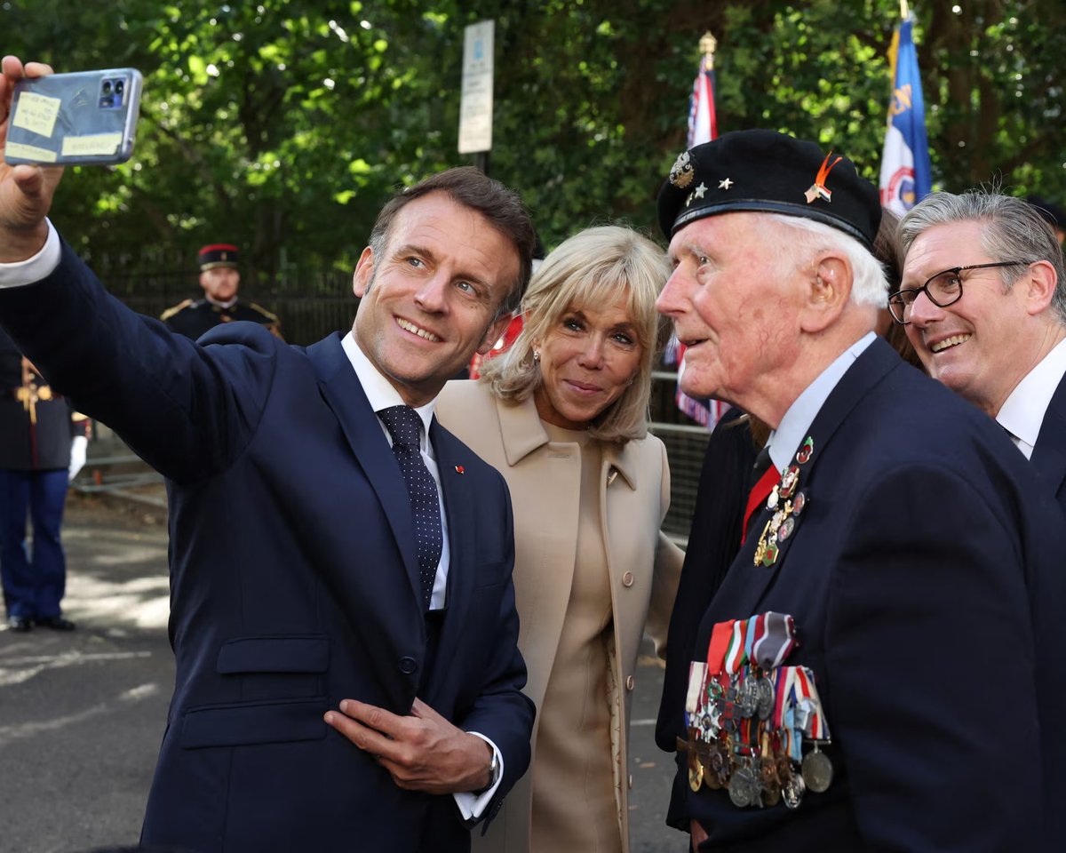 Anyone know who this guy is on the right with all the medals? Seems a little over decorated for a British serviceman...
