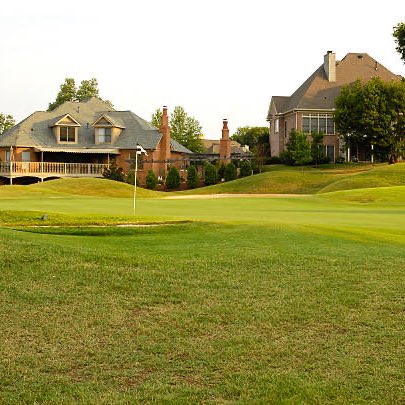 50 yards to the pin

90 yards to the window on that house

You own the local window replacement company 

What club are you hitting?