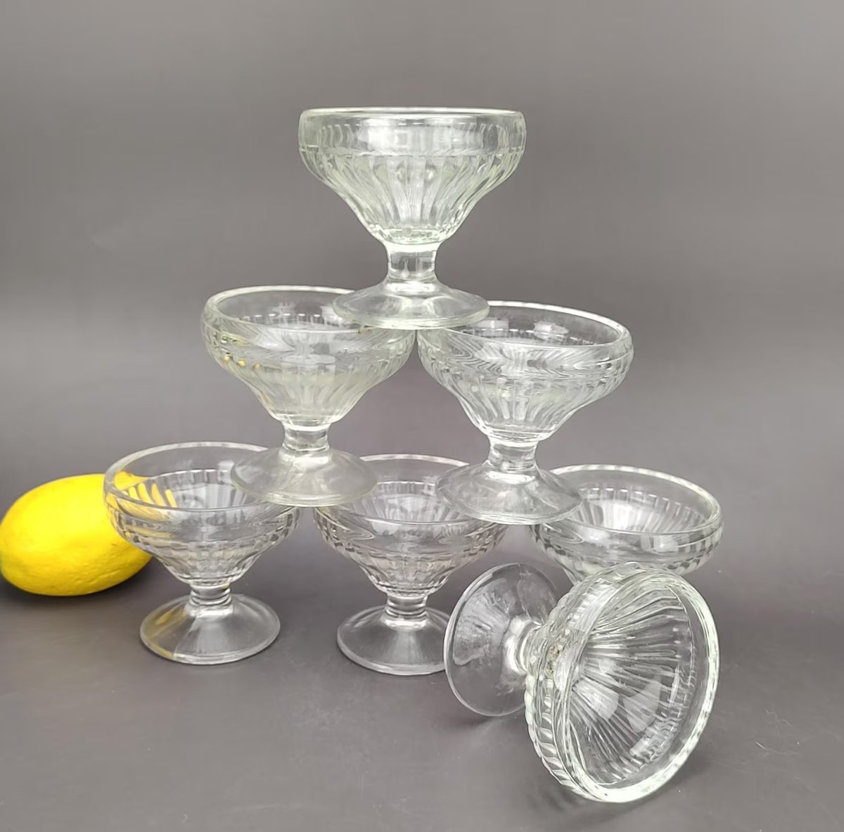 GrandesVtgShop's tweet photo. https://t.co/pN9emC6Izs Jeannette Glass Co. Clear JEG3 Bowl Vertical Ribbed Low Sherbet Dishes Set Of 7 @Etsy @1RetweetMachine #Jeannette #Fountainware https://t.co/EqizRV3cZN