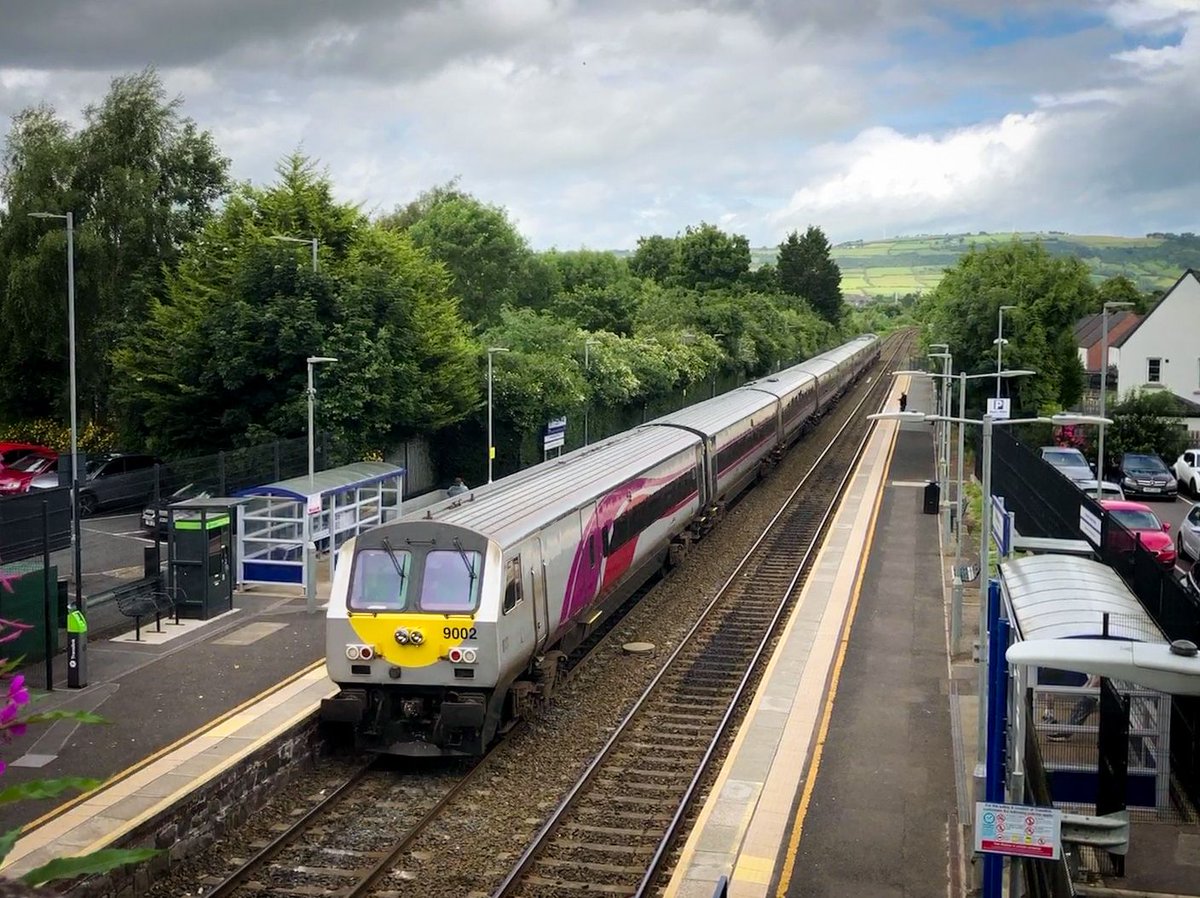 WakefulMadeDis's tweet photo. Enterprise De Dietrich set 9002 trails behind 231 through Whiteabbey station on a much-delayed second sander test run to Templepatrick loop last Thursday (03/07/25). 

#Translink #NIRailways #NIR #Enterprise #IrishRail #IarnrodEireann #IE #Belfast @EnterpriseTrain @Translink_NI https://t.co/NSVSoMbmqw