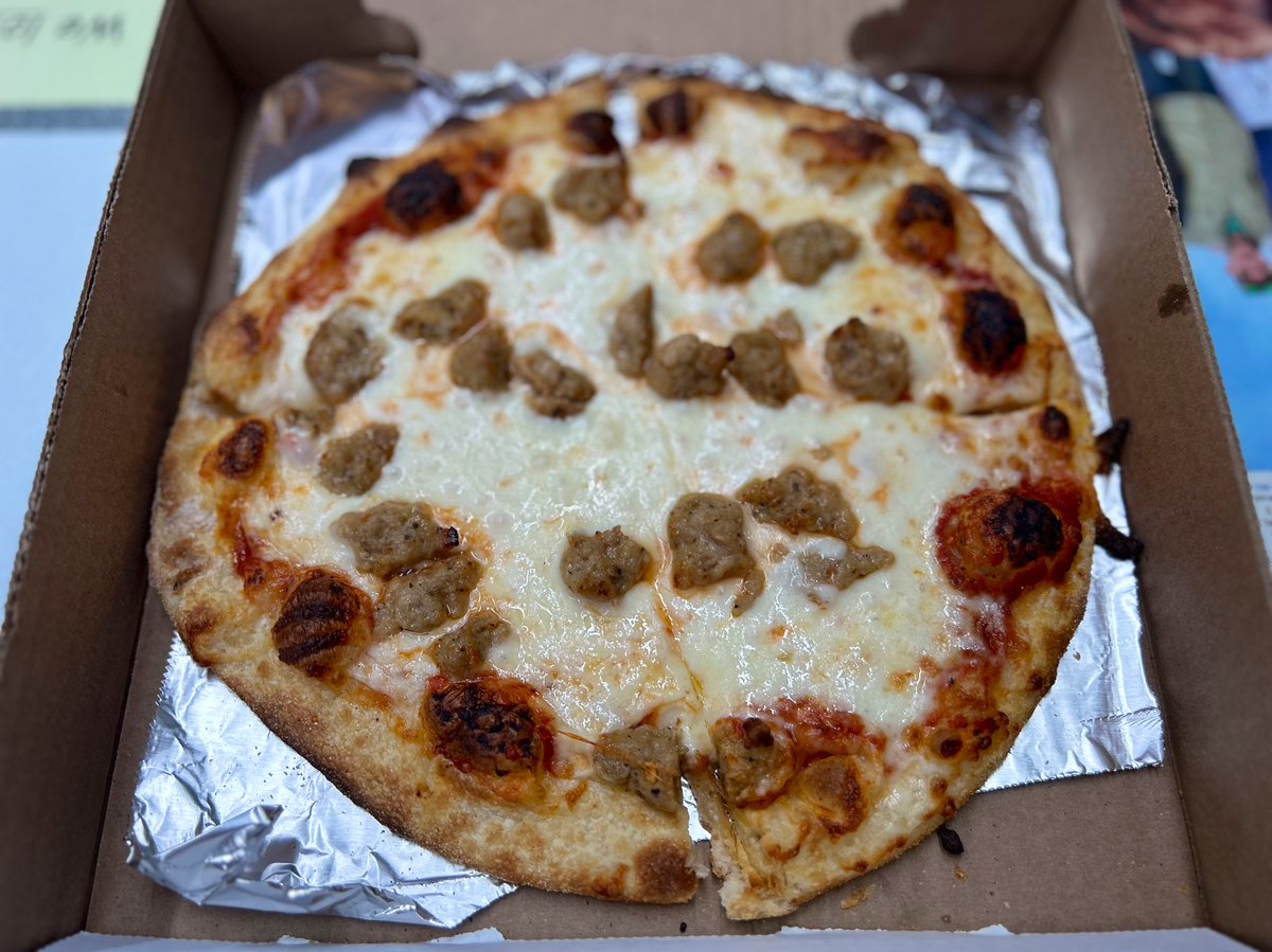 DCOutlook's tweet photo. Cleveland Park Bar & Grill closed its doors last December. It was a sad surprise, but instead of disappearing for good, they merely moved down the block a few doors, taking over the upstairs of @FatPetesBBQ. Their pizza 🍕has changed (for the better) with an 8” pie with 1 topping for only $12.50. As for the pie, the cheese is otherworldly (although a tad underdone.) It’s thick, gooey & delicious. Sausage is plentiful, well-sized & zesty. The crust had a nice char on top (in spots) and ok on the bottom. Tomato sauce is fine, but not all that memorable. Luckily the cheese alone transcends the overall grade to a B+.