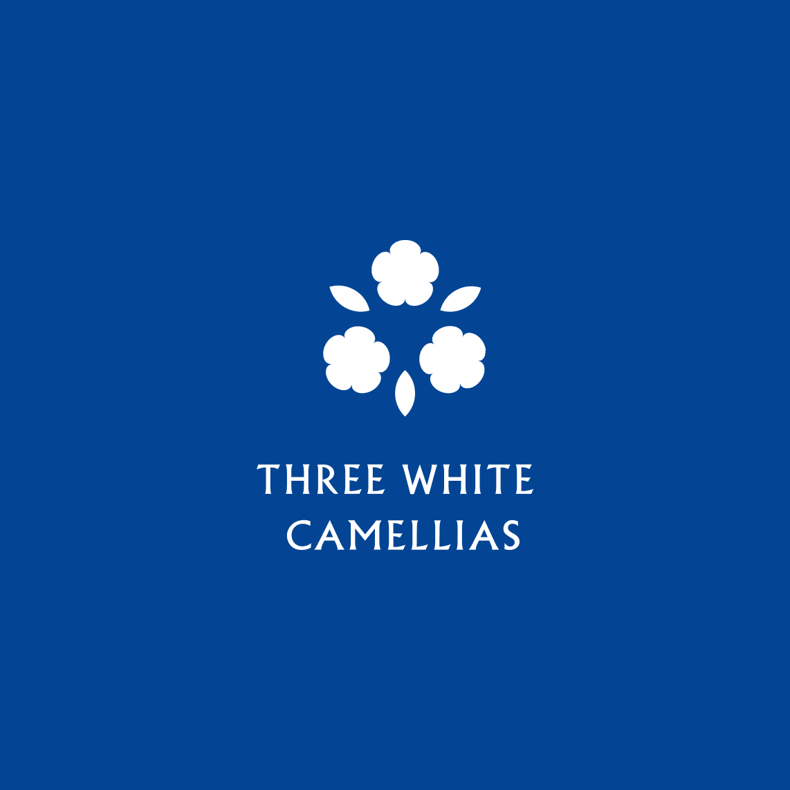 tompparkes's tweet image. Print design work for my (talented) mum’s poetry book. The three white camellias in the logo symbolise my sister, my brother, and me.