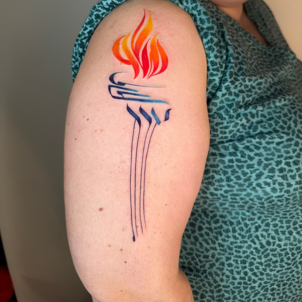 HebTats's tweet photo. Alanna reached out with a vision that was both deeply personal and defiant. In Israel, during her Study Abroad program, she felt truly at home. For the first time, she could embrace her full identity: Jewish, queer, and free.⁠
⁠
#TattooArt https://t.co/wwBDMDm2On