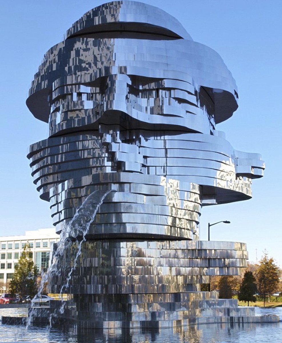 METALmorphosis is a large (23 feet hight, weighing 13 tons) kinetic sculpture of a human head, by Czech artist David Černý. The sculpture is at the Whitehall Corporate Center in Charlotte, North Carolina