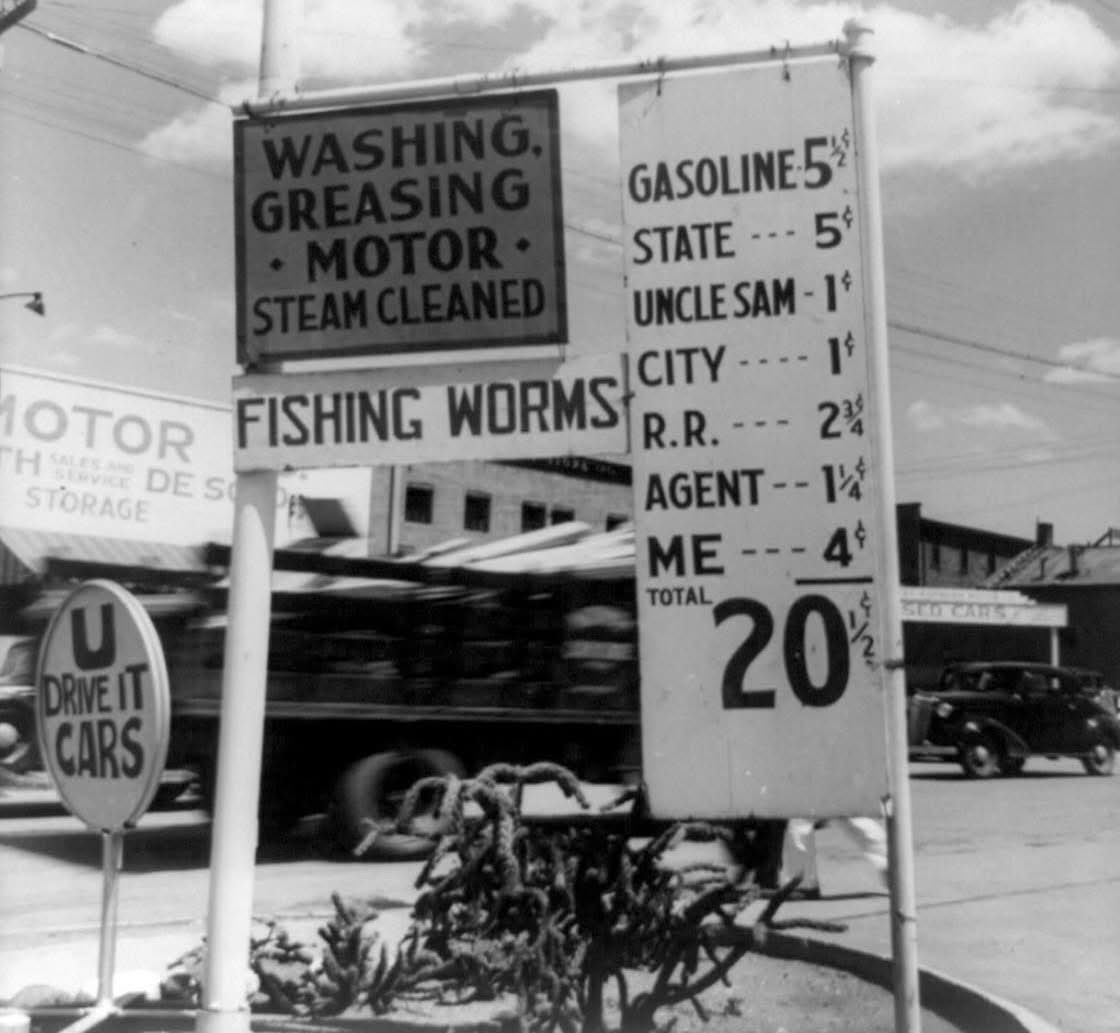 A gas station in Santa Fe, New Mexico, 1938, shows a detailed and honest breakdown of the gas price. Everyone gets a cut.

When adjusted for inflation, that $0.20 total is approximately $4.50 today.-History Kids