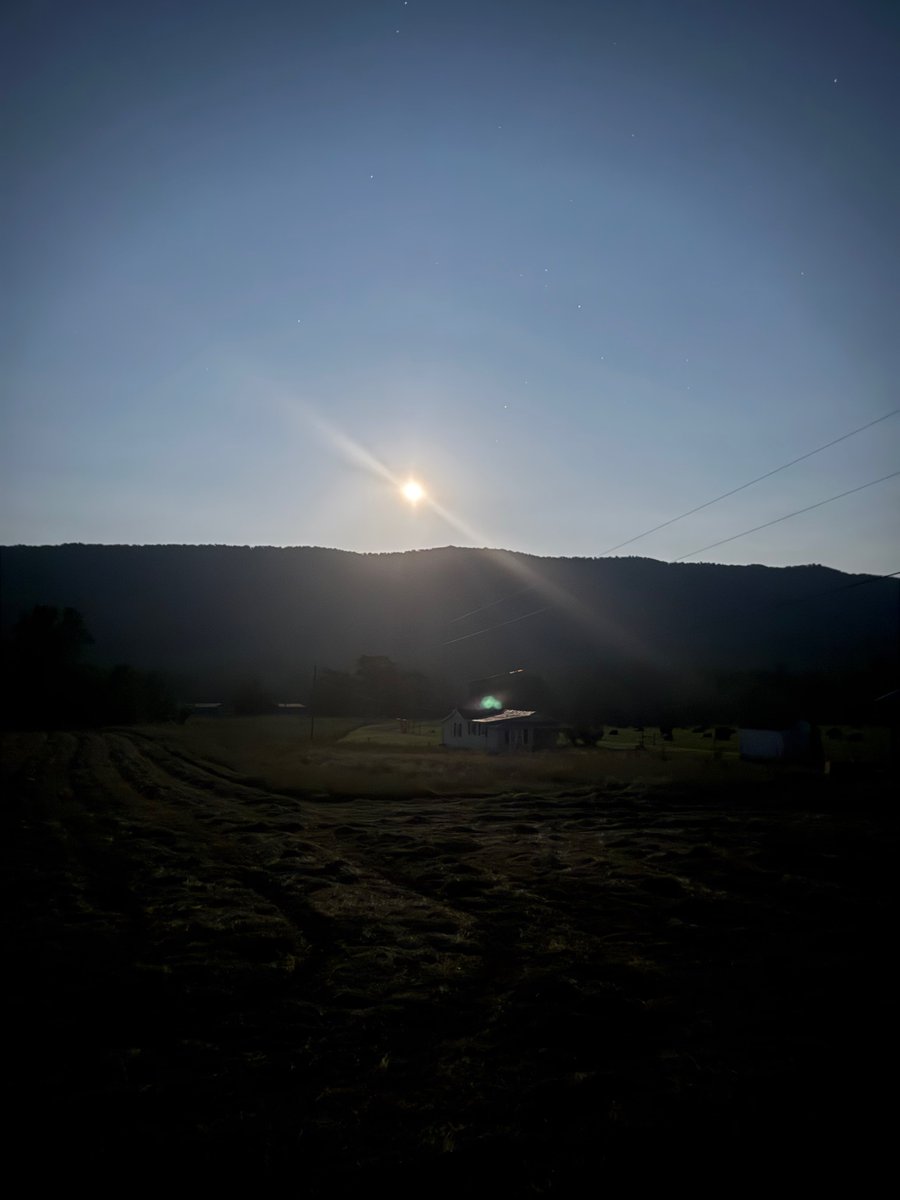 Pretty moonrise over the old home place in the Appalachian foothills. Almost looks like a sunrise. Hay to be baled.