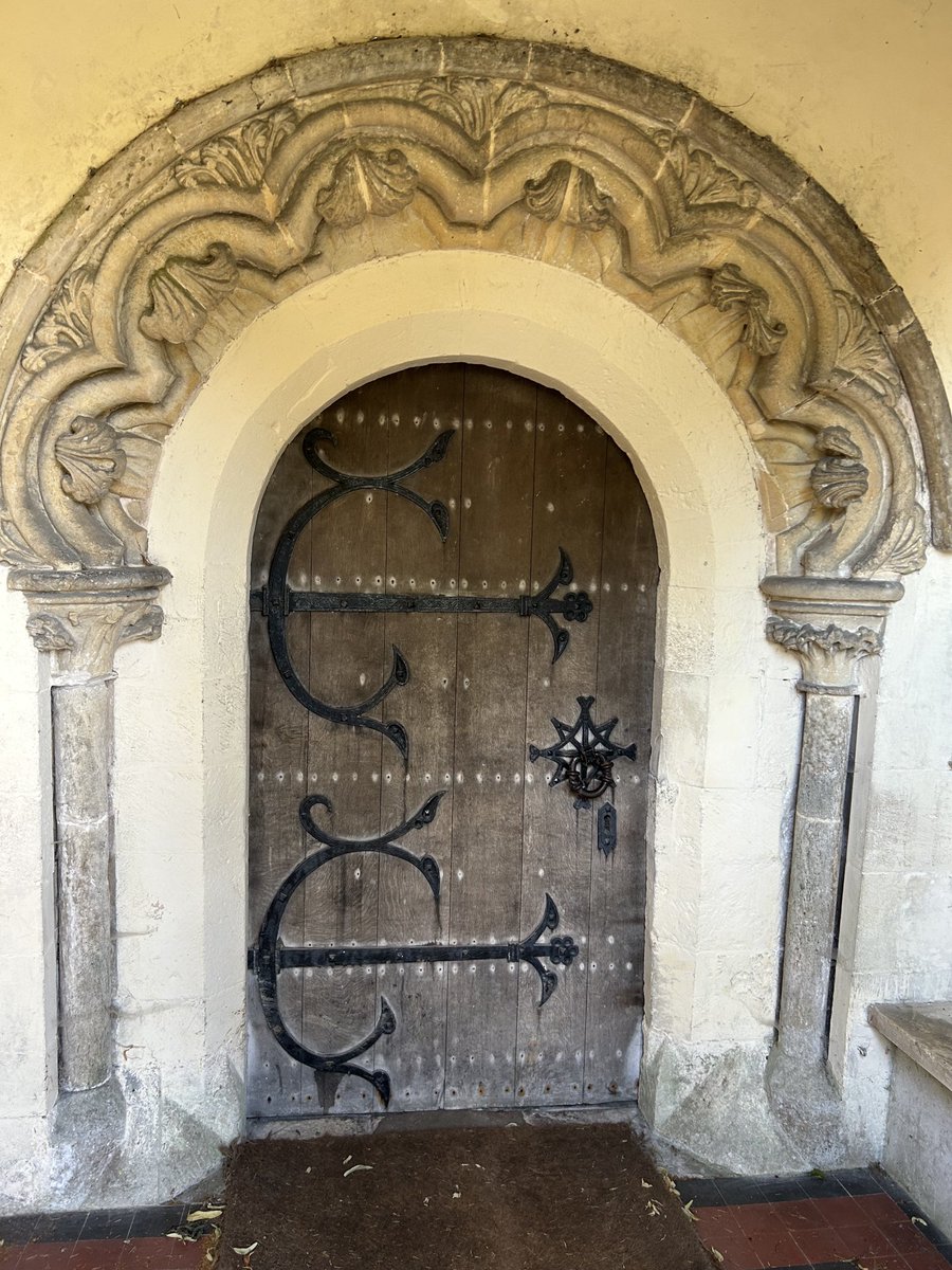 Doorway to St Nicholas of Myra, Ozleworth, Gloucestershire. The skies around this little church in its ancient circular churchyard were full of house martins and swifts on a hot July day. ⁦<a href="/TheCCT/">Churches Conservation Trust</a>⁩ #AdoorableThursday