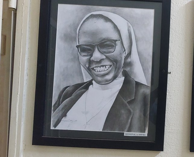 This is  Prof. Sis. Domnic Dipio.

The only professor of film at <a href="/Makerere/">Makerere University</a> . Upon turning 64 last year, she applied for a post-retirement contract – goes up to 80 – but was denied for political reasons. Mbu she belongs to an "uncontrollable dept": Literature.

A very, very