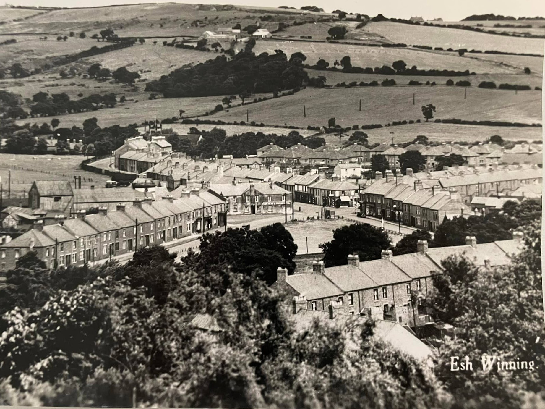 Part of the football ground can be seen on the left of this postcard from the inter-war period. Unknown original source.