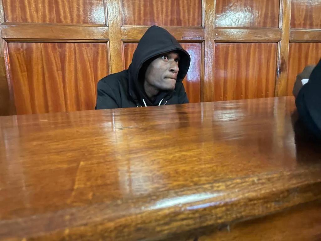 C_NyaKundiH's tweet photo. Officer Klinzy Masinde Baraza, who fatally shot mask vendor Boniface Kariuki Mwangi in Nairobi on June 17, appeared in court visibly shaken, crying, flanked only by his family.

Not a single official from the National Police Service showed up to support him.

Let this be a lesson.

When you kill, you’ll face it alone.

When you shoot someone in the leg on orders, you’ll still go to jail alone.

Those who give you these orders will be with their families as your kids visit you in jail

#ShootFirstSir