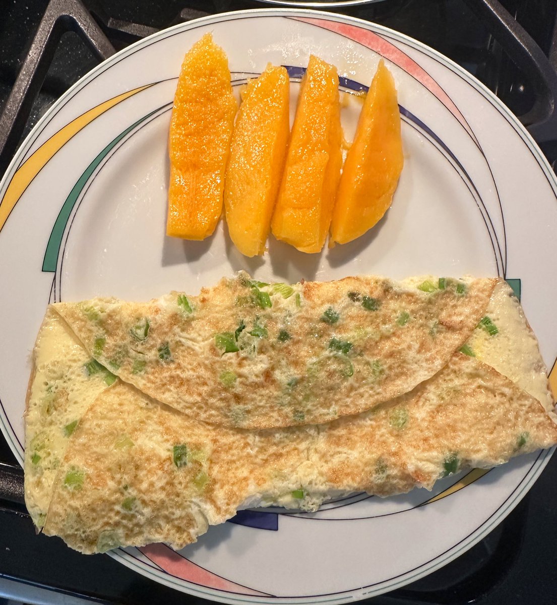 Good eats for breakfast over here. 

Scallion eggs, buttered toast, a super ripe mango, &amp; banana. 

#breakfast #brekkie #goodeats