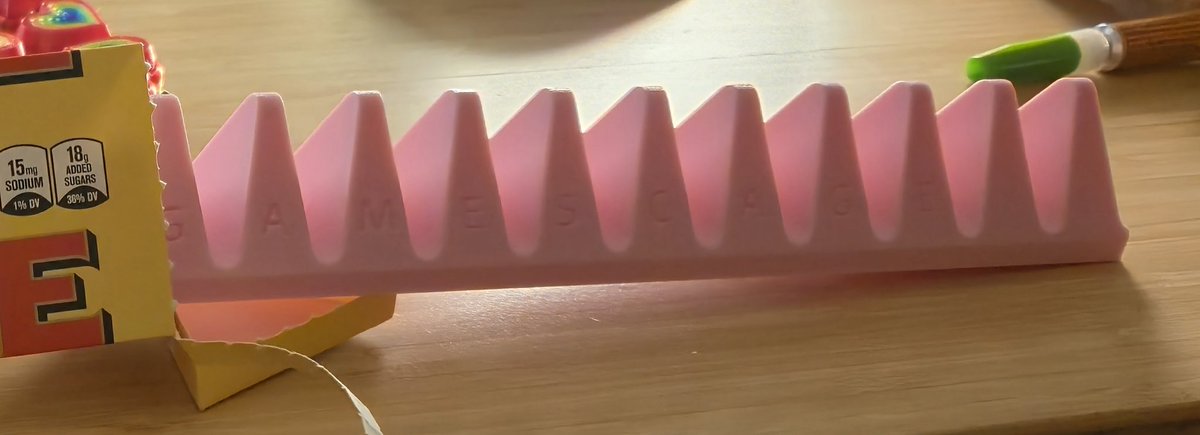 DinnerSonic's tweet photo. @GamesCage_ Happy birthday, dude! I couldn't find you at AX on July 4th to give you a dumb gift but couldn't, so I guess I just own a 3d printed Gamescage Toblerone. https://t.co/qZ6H0EeZcC