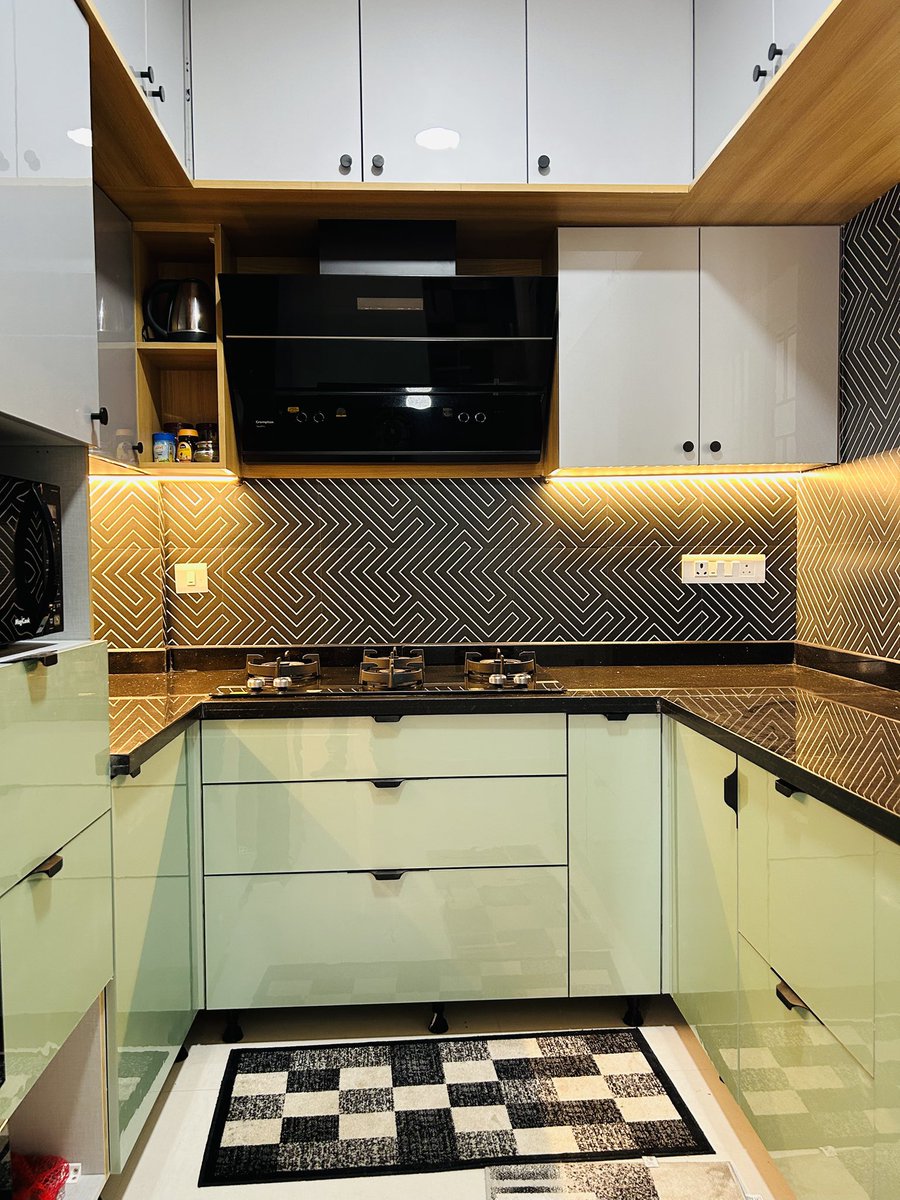 olangana_design's tweet image. Sleek. Stylish. Smart.

&quot;The stylish geometric backsplash tiles are stealing the spotlight in this minimalist kitchen space. Designed and flawlessly executed by Olangana Design, the compact layout features calming hues of blue and beige, paired with a sleek, polished finish.