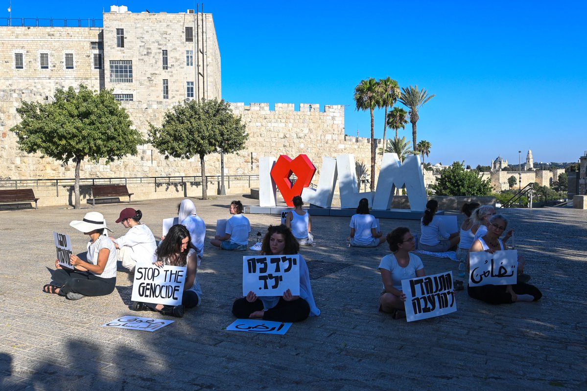 flom_jess's tweet image. Women Sit for Peace sat in silent protest today with messages against genocide, child abuse, and the occupation in Gaza and Palestine.