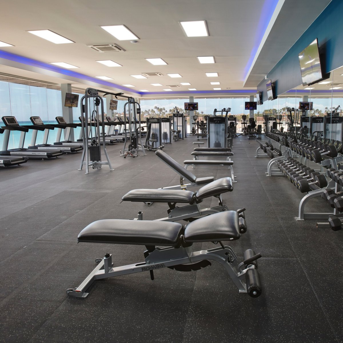 Keep your fitness goals on track—even on vacation! 🏋️ 

Our oceanfront fitness center has everything you need for a workout, all combined with stunning beach views. Discover all the ways you can stay active at our resorts—bit.ly/3TGVBAQ