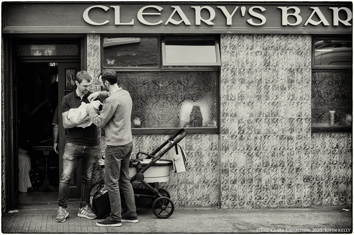 Left Holding The Baby...Brothers Cathal and Conor Fleming join forces to deal with the basic needs of Cathal's one month old baby Darragh, outside a pub during the Willie Clancy Summer School at Miltown Malbay. Shot for <a href="/ClareChampion/">The Clare Champion</a> #willieclancyweek <a href="/ss_willieclancy/">SSWillieClancy</a>