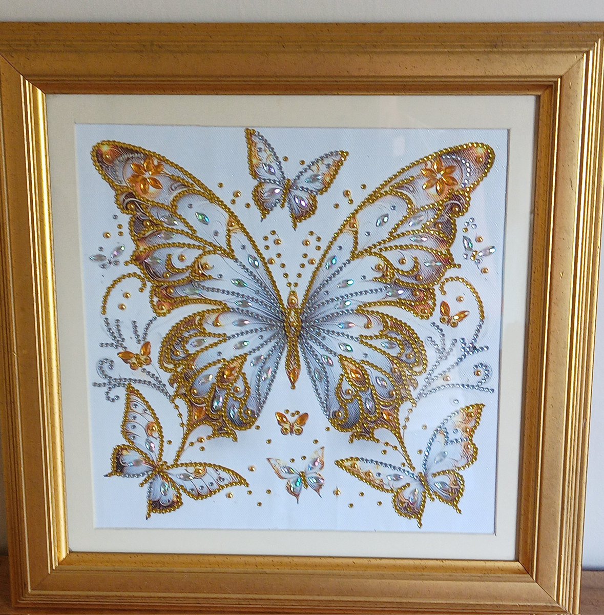 My butterfly diamond art is finished and framed.