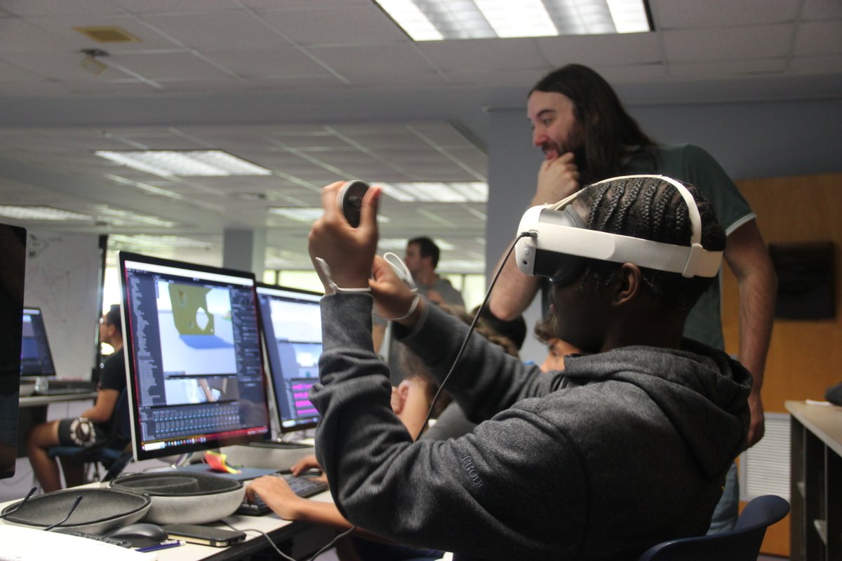 UofNO's tweet image. High school students in the BeyondReality@UNO summer camp are diving into virtual reality, learning 3D modeling, animation, and scripting to design their own VR games. Today, they explored their creations for the first time using VR headsets. 🕹🎮