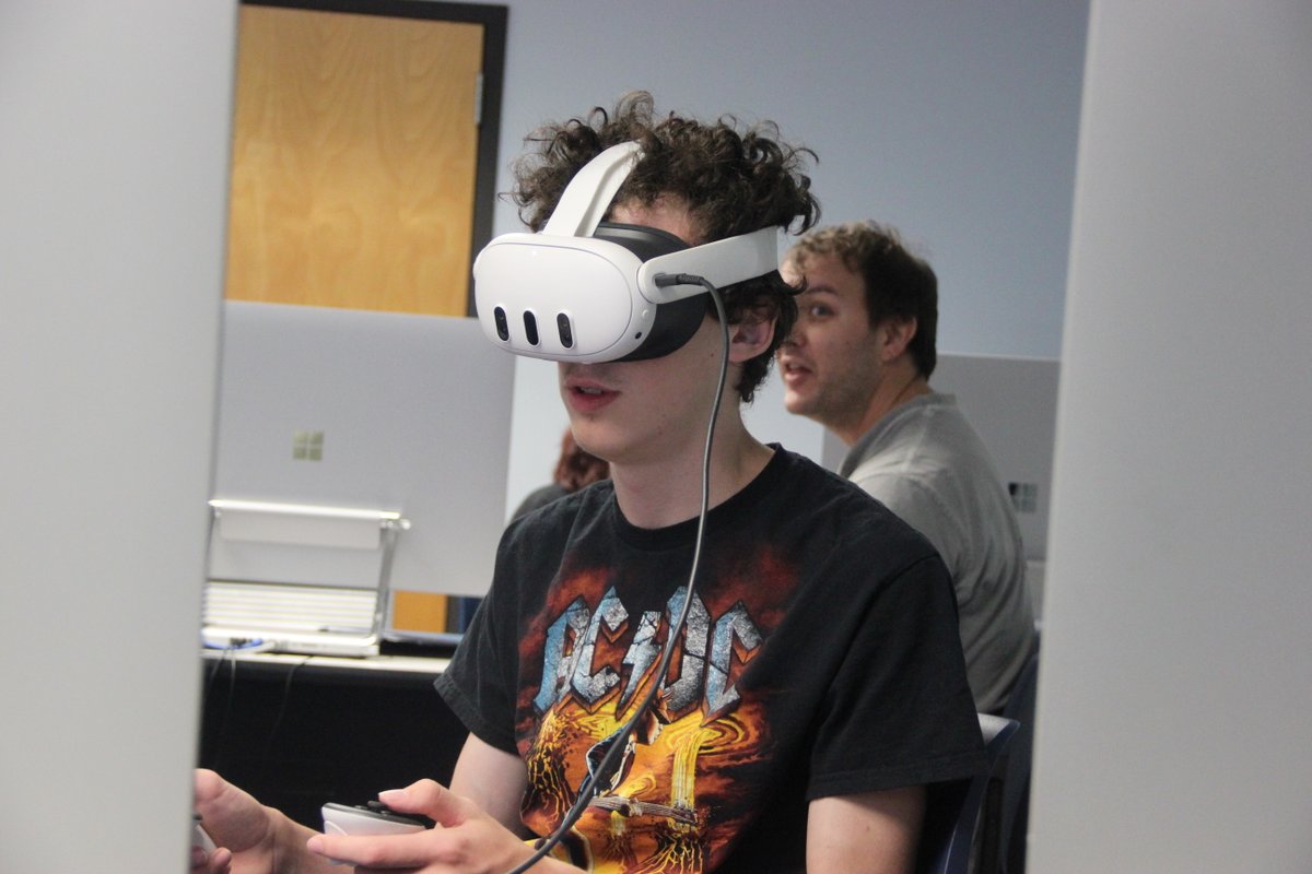 UofNO's tweet image. High school students in the BeyondReality@UNO summer camp are diving into virtual reality, learning 3D modeling, animation, and scripting to design their own VR games. Today, they explored their creations for the first time using VR headsets. 🕹🎮