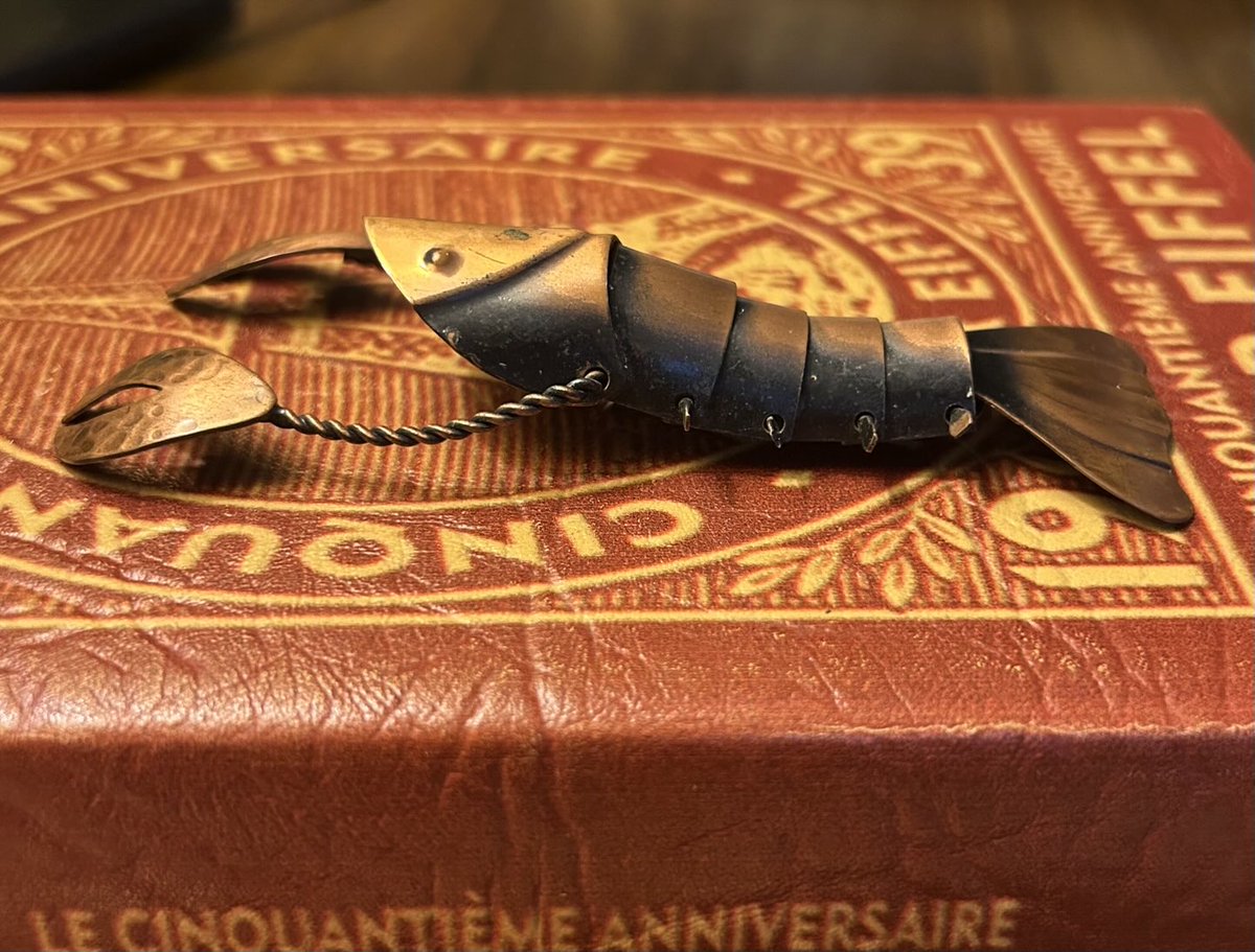 szacharek's tweet image. At last, I have acquired the circa 1950 Frank Rebajes articulated copper lobster brooch I have wanted for—no joke—20+ years. Pic 3 is a postcard of the Rebajes store on 5th Ave, which he opened in 1942. Doesn’t it look amazing? Wish I had a time machine!