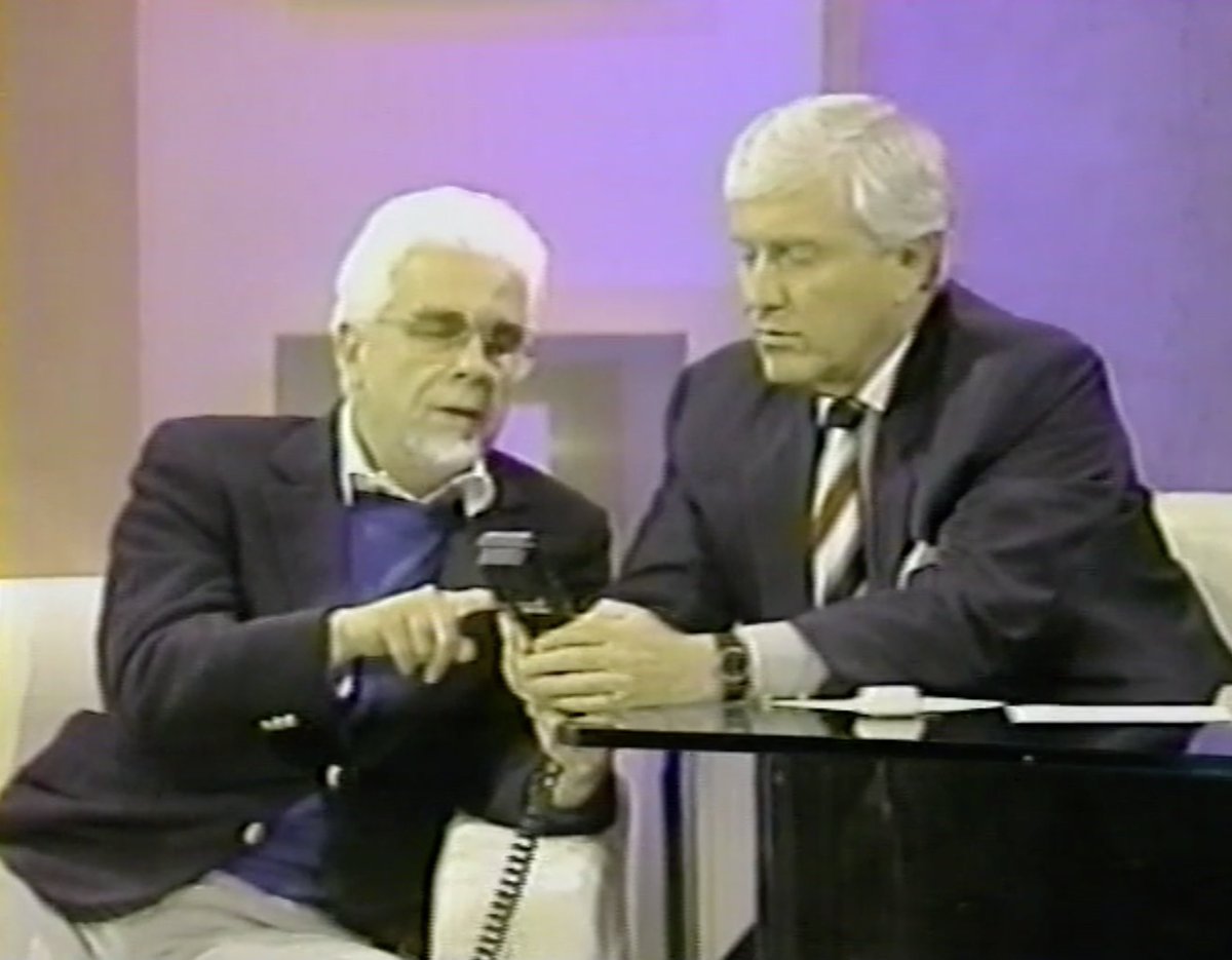 peternero's tweet photo. Peter shows Merv Griffin how to use his "personal telephone." He was always ahead of the curve with gadgets. https://t.co/RLcmdpSJuW