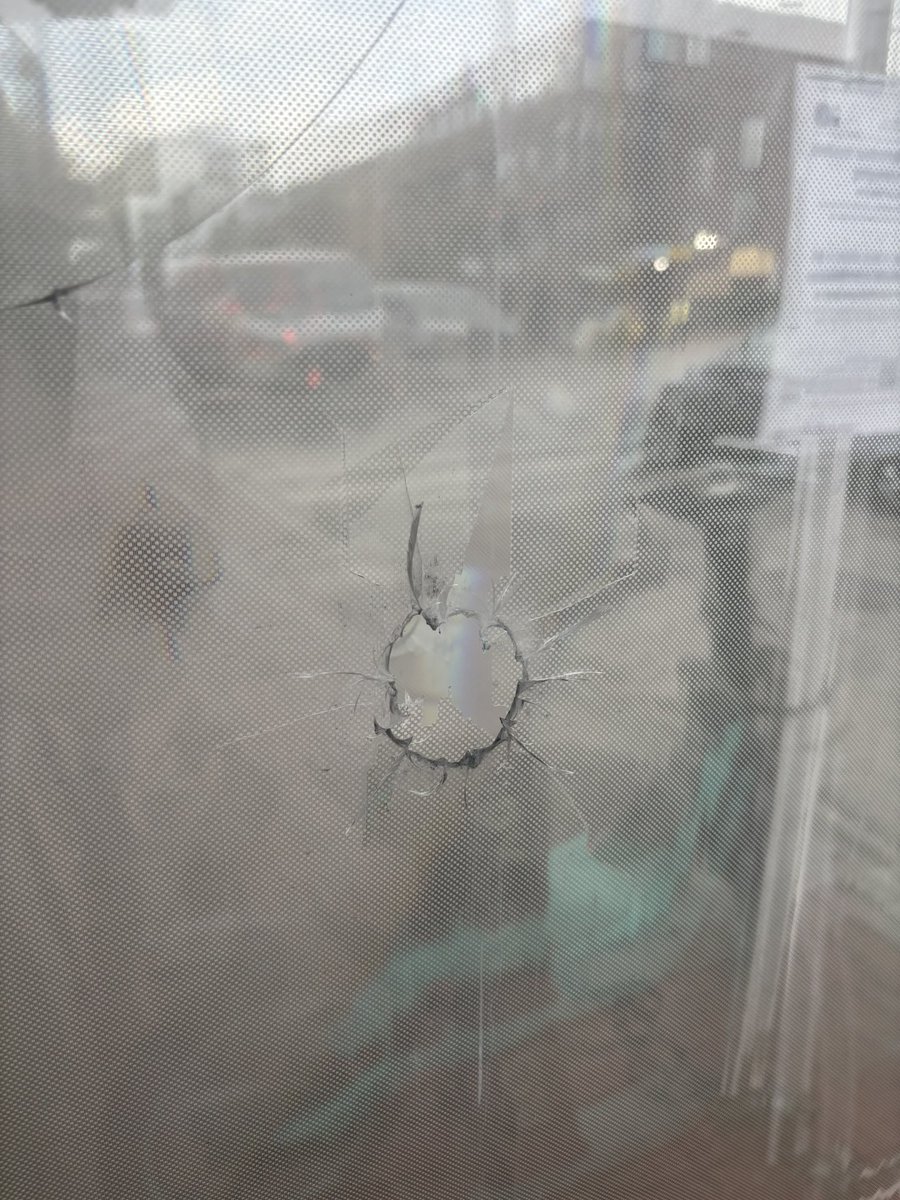 ScottThuman's tweet image. Wow. 10 days after a Congressional intern, 21 year old Eric Tarpinian-Jachym, was shot and killed at a bus stop just feet away from DC’s convention center, a half dozen bullet holes are *still* visible. It must be unsettling to say the least, for visitors or residents passing by…