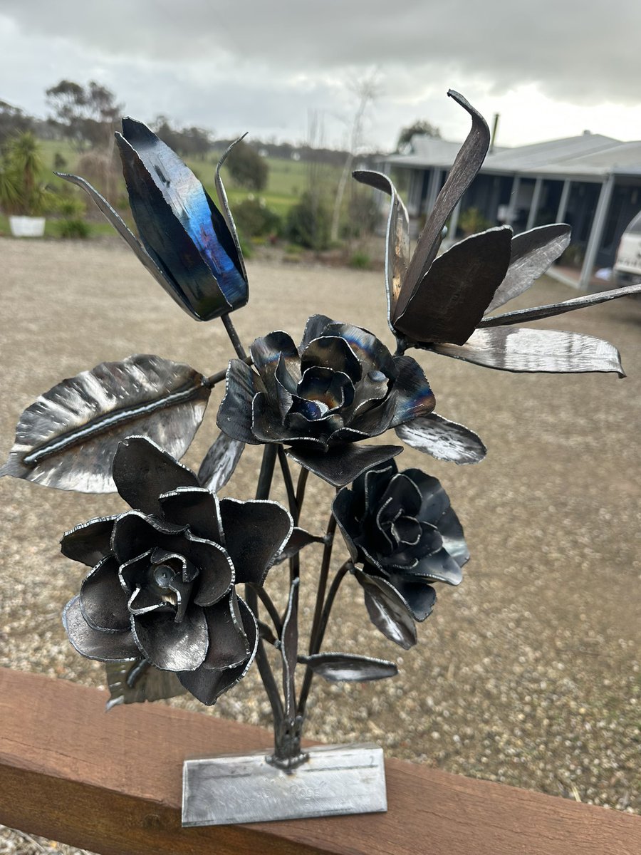 Piece #2. 

“Rilla’s Rose”

3 roses
2 Lilly’s
2 rubber plant leaves
7 small leaves. 

Hope you all like it.