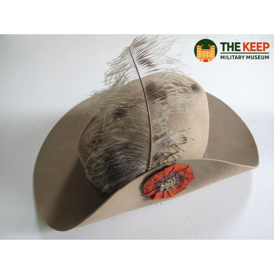 Slouch Hat worn by Trooper Woolfrey. This hat dates from the Boer War when Woolfrey was serving as part of the 26th Dorset Company, Imperial Yeomanry. There's an Imperial Yeomanry red and blue cockade on the left side bearing a brass title 'QO DORSET IY' and grey ostrich feather