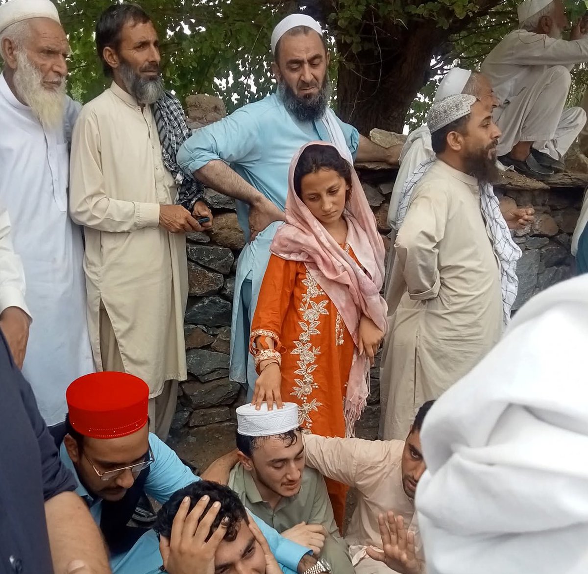 The daughter of Maulana Khan Zeb stands by his grave, holding back her grief — offering strength and patience to her brother, even as her own world falls apart.