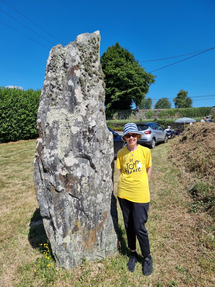 PhilWat09037421's tweet image. Here now at the menhir in St-Mayeux with Julia for scale. Very busy already and still hours before letour2025 arrives.