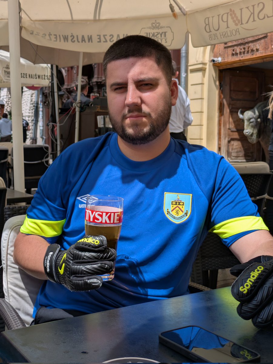 Muric is taking the piss now. Drinking in Poland in a Burnley shirt. #itfc