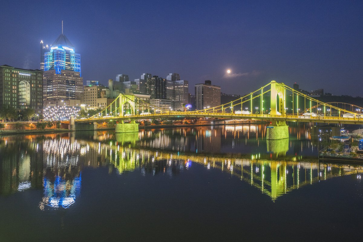 DaveDiCello's tweet image. This morning the bridges of #Pittsburgh were lit up green for #Picklesburgh, and I had a ton of fun capturing the setting moon behind them. The giant pickle is back on the Clemente Bridge, and I'm looking forward to checking out the festival this weekend.