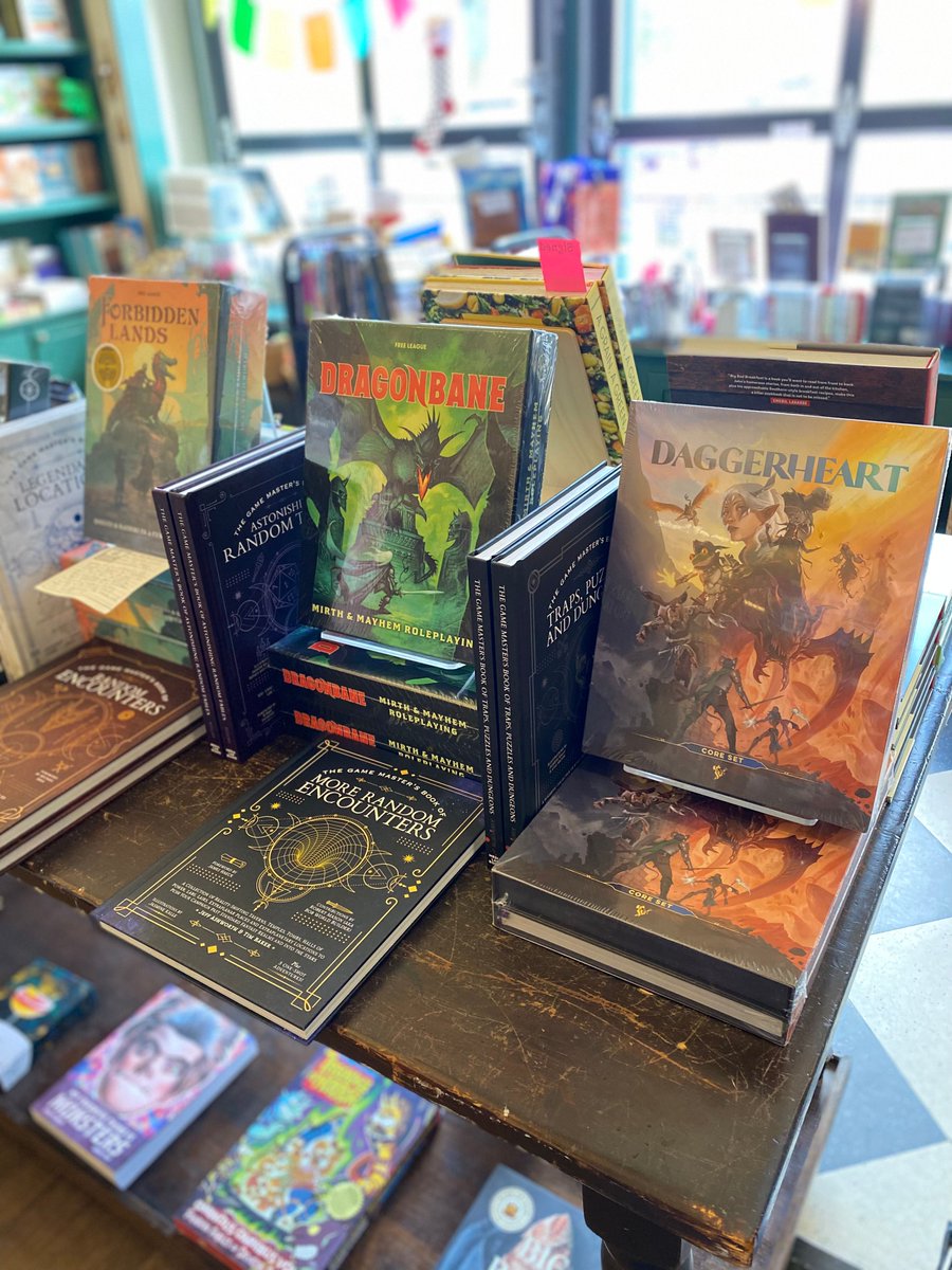 SquareBooks's tweet image. New games alert! We've got some more awesome game kits and companion books from Free League for y'all to choose your next adventure! New to our table are Symbaroum, a dark fantasy RPG, and Forbidden Lands, which is a SUPER fun sandbox survival RPG! #TabletopSummer #ShopIndie