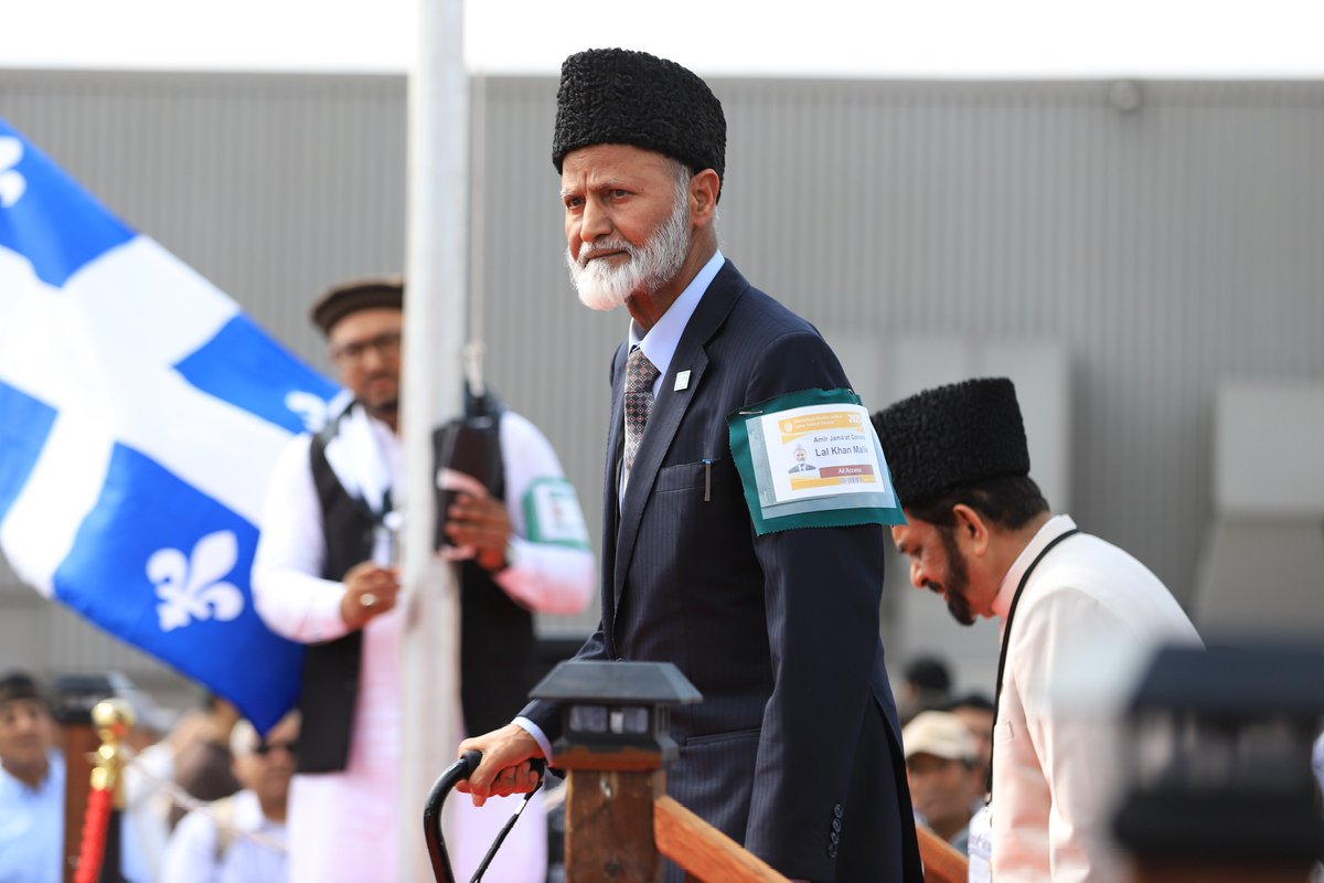 Jalsa_Canada's tweet photo. Scenes from the flag hoisting ceremony — marking the official start of the 47th Jalsa Salana Canada.

Side by side, the Canadian flag and Liwa-e-Ahmadiyyat were raised — a powerful symbol of loyalty to country and devotion to faith. A proud and blessed moment for all.

#JalsaCanada
