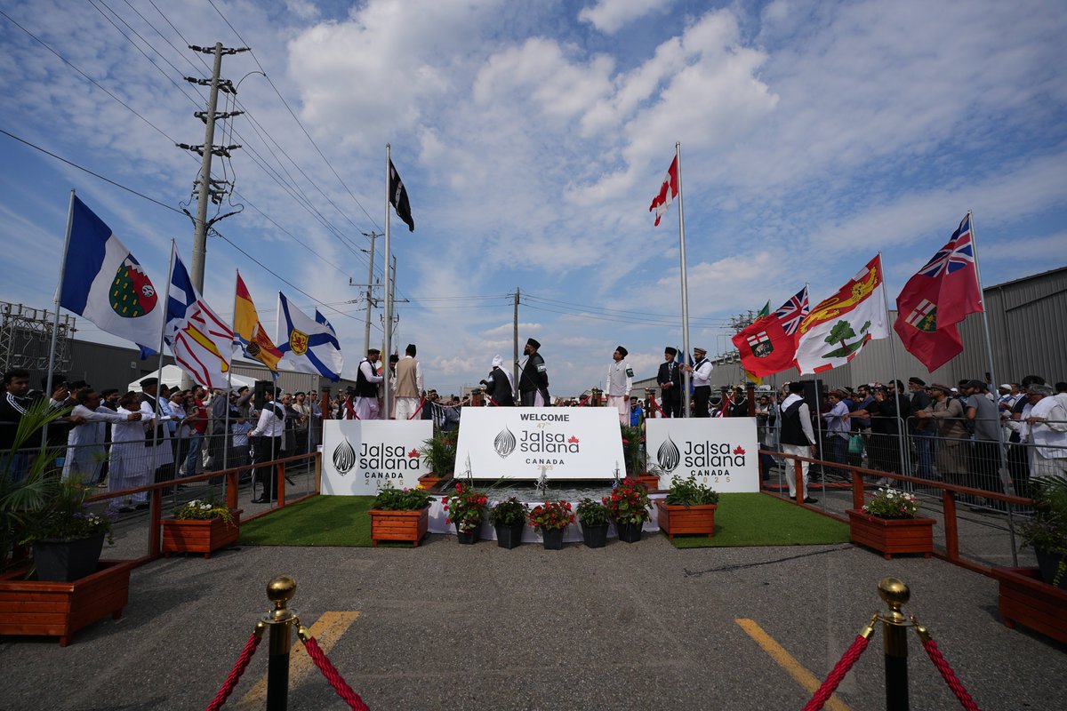 Jalsa_Canada's tweet photo. Scenes from the flag hoisting ceremony — marking the official start of the 47th Jalsa Salana Canada.

Side by side, the Canadian flag and Liwa-e-Ahmadiyyat were raised — a powerful symbol of loyalty to country and devotion to faith. A proud and blessed moment for all.

#JalsaCanada