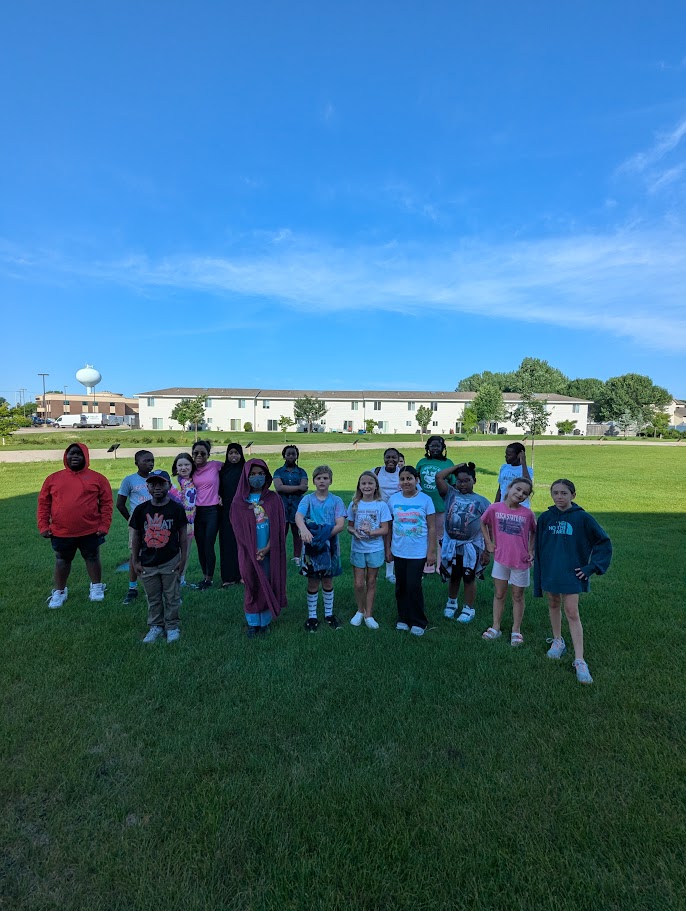 Ed Clapp Elementary School summer school students helped to install the new Storywalk story at the school. "Our Pool" written and illustrated by Lucy Ruth Cummins will be on display through August.