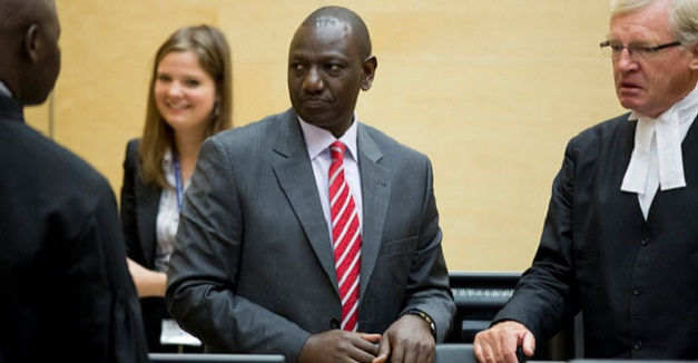 amenya_nelson's tweet photo. During the 2022 election, Ruto complained to international journalists for using his photo while he was at the ICC court. He didn't like it so I am thinking why don't we normalise posting his ICC photos? That way when he comes online he will be reminded that he is a murderer. You can add Kiambaa church too thats his legacy.