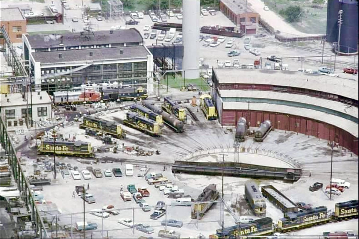 The Santa Fe roundhouse in Cleburne, 1972.  The last time I used the word "roundhouse" in a post one of y'all asked what a roundhouse is, so, briefly, a railroad roundhouse is a circular or semicircular building traditionally used for servicing and storing locomotives, especially