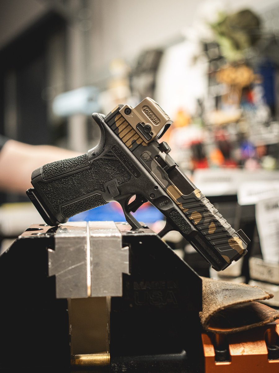 JagerWerks's tweet image. I don't personally always vibe with the camo stuff, but with a lot of serrations and a tan optic this looks so dang good.
F9 with chamfer and serrations, top serrations, and enhanced rears. Damn.
